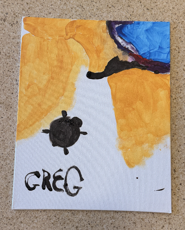 Canvas showing a turtle moving along a sandy shoreline toward the water.